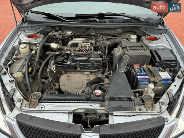 Серый Мицубиси Лансер, объемом двигателя 1.6 л и пробегом 242 тыс. км за 4300 $, фото 14 на Automoto.ua