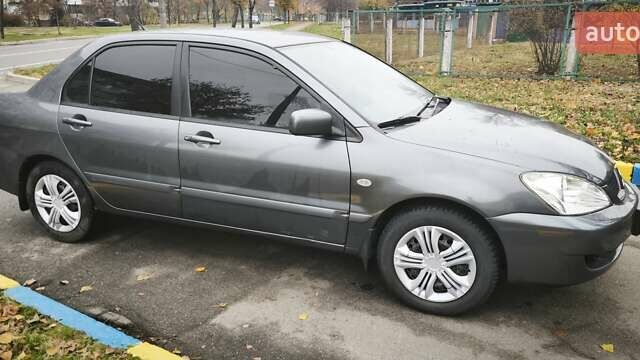 Серый Мицубиси Лансер, объемом двигателя 1.6 л и пробегом 263 тыс. км за 3800 $, фото 7 на Automoto.ua