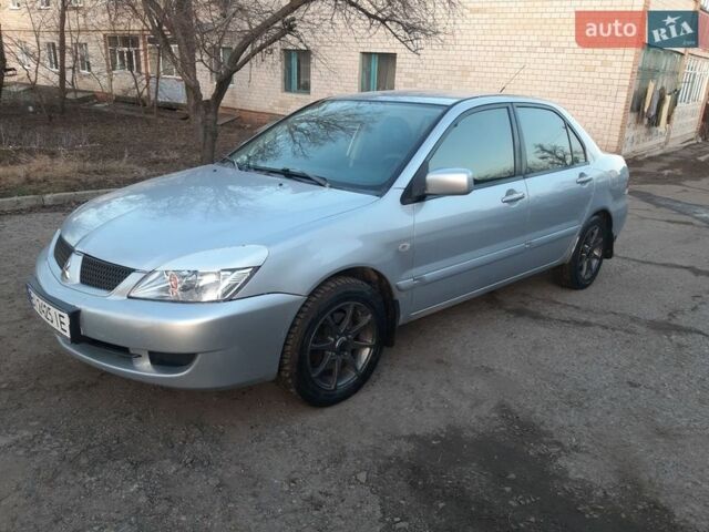 Серый Мицубиси Лансер, объемом двигателя 1.58 л и пробегом 187 тыс. км за 2699 $, фото 4 на Automoto.ua