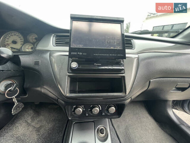 Сірий Міцубісі Lancer, об'ємом двигуна 1.58 л та пробігом 162 тис. км за 4650 $, фото 15 на Automoto.ua