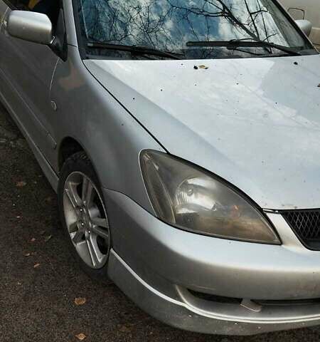 Серый Мицубиси Лансер, объемом двигателя 2 л и пробегом 284 тыс. км за 4100 $, фото 2 на Automoto.ua