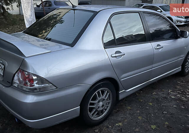 Серый Мицубиси Лансер, объемом двигателя 2 л и пробегом 307 тыс. км за 3999 $, фото 12 на Automoto.ua