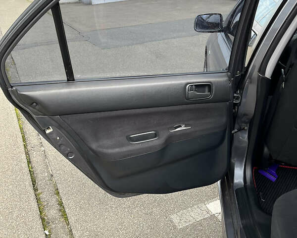 Сірий Міцубісі Lancer, об'ємом двигуна 1.6 л та пробігом 260 тис. км за 4998 $, фото 5 на Automoto.ua