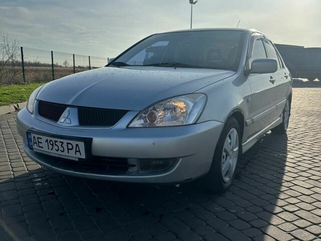 Серый Мицубиси Лансер, объемом двигателя 1.6 л и пробегом 170 тыс. км за 3700 $, фото 1 на Automoto.ua