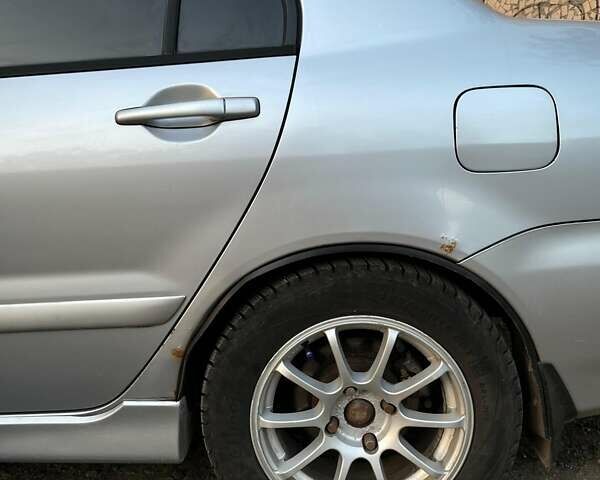 Сірий Міцубісі Lancer, об'ємом двигуна 1.6 л та пробігом 225 тис. км за 4200 $, фото 6 на Automoto.ua