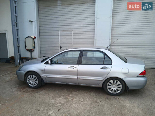 Серый Мицубиси Лансер, объемом двигателя 1.58 л и пробегом 215 тыс. км за 4000 $, фото 4 на Automoto.ua