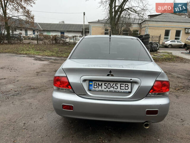 Сірий Міцубісі Lancer, об'ємом двигуна 1.58 л та пробігом 308 тис. км за 3700 $, фото 5 на Automoto.ua