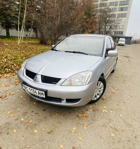 Серый Мицубиси Лансер, объемом двигателя 1.6 л и пробегом 253 тыс. км за 2850 $, фото 1 на Automoto.ua