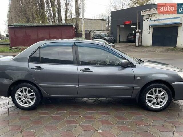 Сірий Міцубісі Lancer, об'ємом двигуна 1.6 л та пробігом 262 тис. км за 4400 $, фото 6 на Automoto.ua