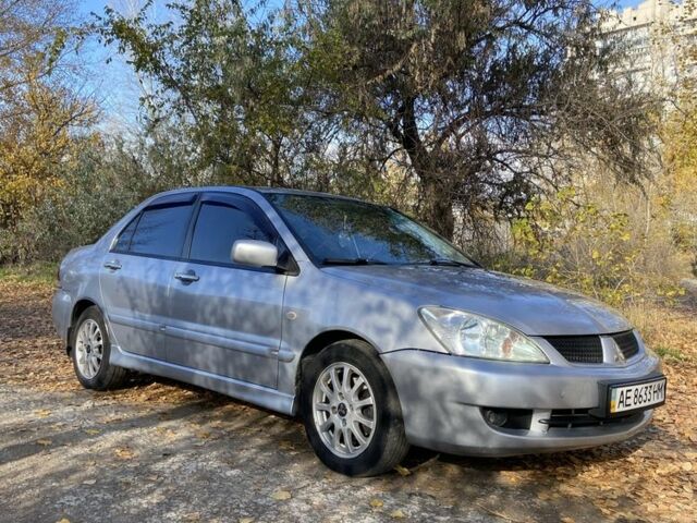 Серый Мицубиси Лансер, объемом двигателя 1.6 л и пробегом 204 тыс. км за 3999 $, фото 5 на Automoto.ua