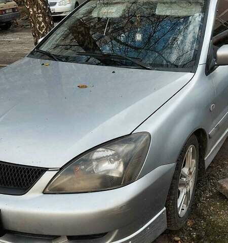 Серый Мицубиси Лансер, объемом двигателя 2 л и пробегом 284 тыс. км за 4100 $, фото 3 на Automoto.ua