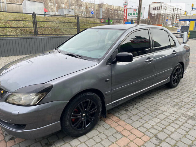 Сірий Міцубісі Lancer, об'ємом двигуна 1.58 л та пробігом 228 тис. км за 4300 $, фото 4 на Automoto.ua