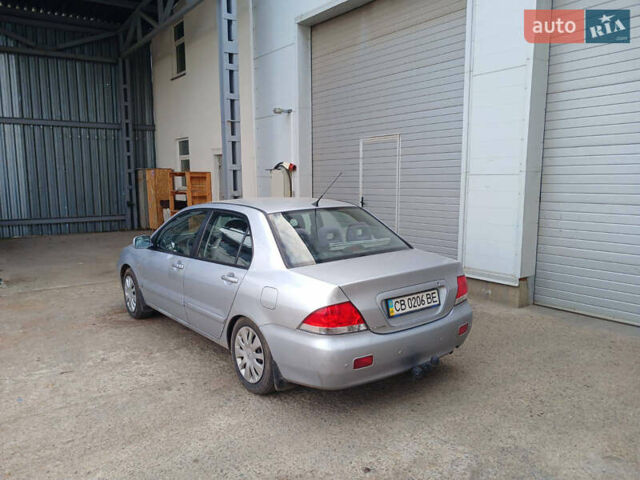 Серый Мицубиси Лансер, объемом двигателя 1.58 л и пробегом 215 тыс. км за 4000 $, фото 5 на Automoto.ua