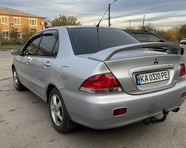 Сірий Міцубісі Lancer, об'ємом двигуна 1.58 л та пробігом 430 тис. км за 2550 $, фото 6 на Automoto.ua