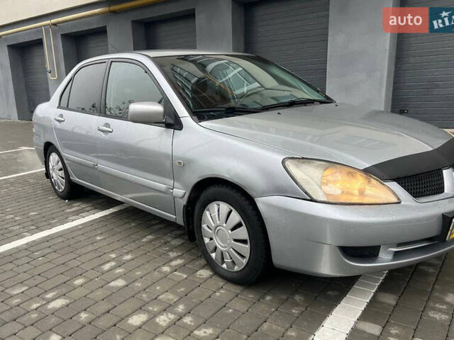 Сірий Міцубісі Lancer, об'ємом двигуна 1.58 л та пробігом 333 тис. км за 2999 $, фото 2 на Automoto.ua