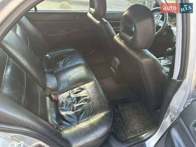 Серый Мицубиси Лансер, объемом двигателя 1.58 л и пробегом 244 тыс. км за 4950 $, фото 9 на Automoto.ua