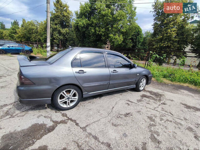 Сірий Міцубісі Lancer, об'ємом двигуна 2 л та пробігом 210 тис. км за 4999 $, фото 3 на Automoto.ua