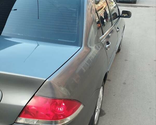 Сірий Міцубісі Lancer, об'ємом двигуна 1.58 л та пробігом 217 тис. км за 3500 $, фото 2 на Automoto.ua