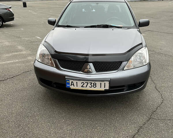 Сірий Міцубісі Lancer, об'ємом двигуна 1.6 л та пробігом 260 тис. км за 4998 $, фото 31 на Automoto.ua