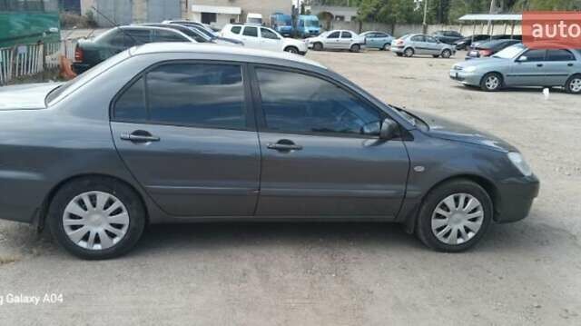 Серый Мицубиси Лансер, объемом двигателя 1.58 л и пробегом 271 тыс. км за 4600 $, фото 5 на Automoto.ua