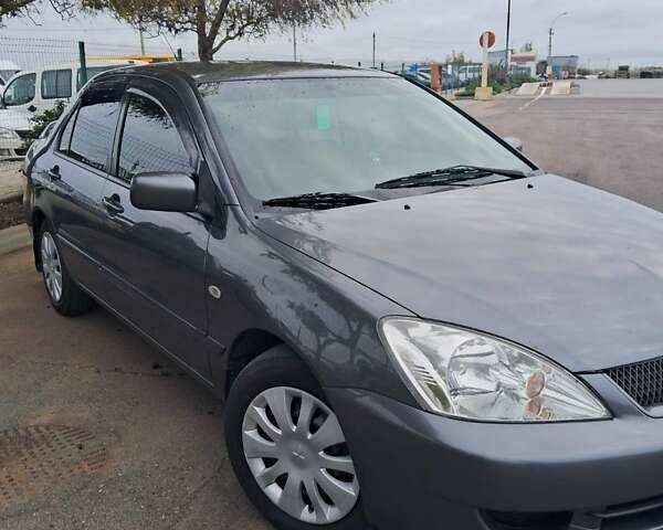 Сірий Міцубісі Lancer, об'ємом двигуна 1.6 л та пробігом 229 тис. км за 4900 $, фото 4 на Automoto.ua