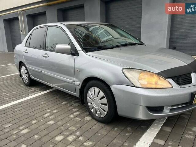 Серый Мицубиси Лансер, объемом двигателя 1.6 л и пробегом 333 тыс. км за 2800 $, фото 4 на Automoto.ua