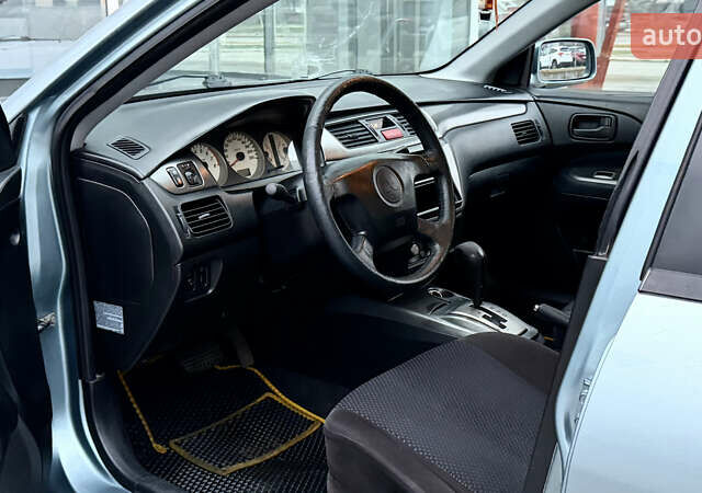 Сірий Міцубісі Lancer, об'ємом двигуна 1.58 л та пробігом 275 тис. км за 4600 $, фото 14 на Automoto.ua
