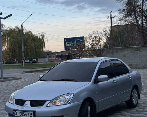 Серый Мицубиси Лансер, объемом двигателя 1.6 л и пробегом 269 тыс. км за 4000 $, фото 1 на Automoto.ua