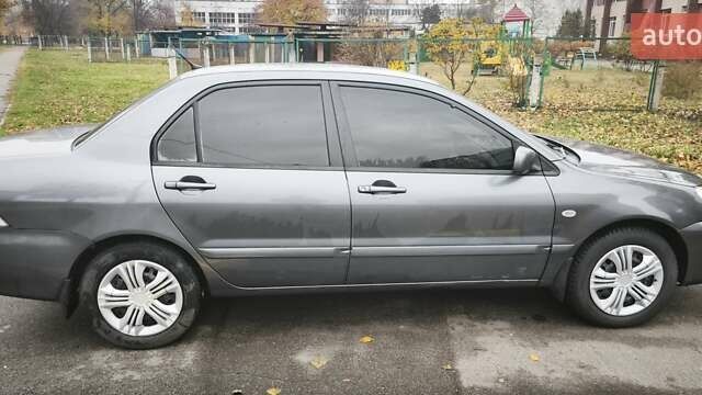 Серый Мицубиси Лансер, объемом двигателя 1.6 л и пробегом 263 тыс. км за 3800 $, фото 10 на Automoto.ua