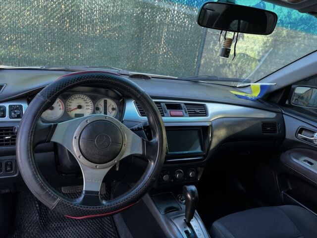 Сірий Міцубісі Lancer, об'ємом двигуна 2 л та пробігом 192 тис. км за 5400 $, фото 7 на Automoto.ua