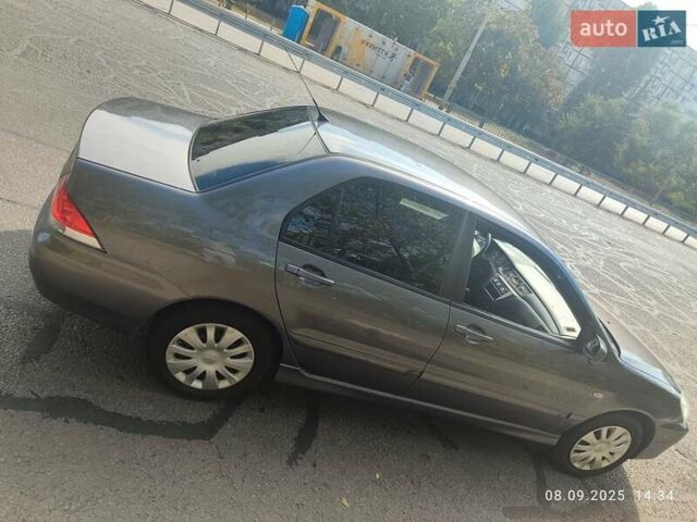 Сірий Міцубісі Lancer, об'ємом двигуна 1.6 л та пробігом 242 тис. км за 4900 $, фото 5 на Automoto.ua