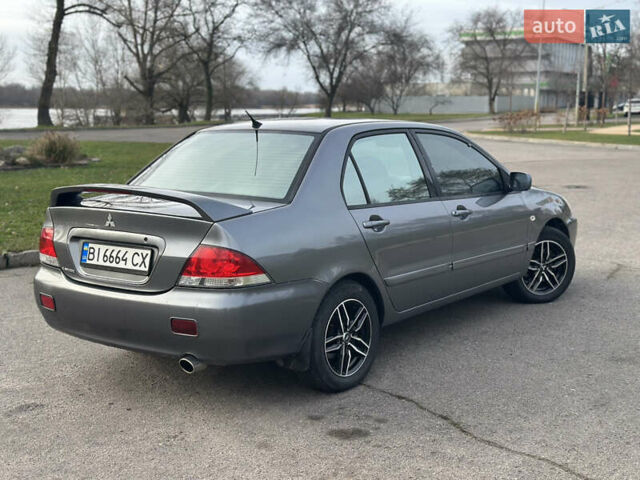 Сірий Міцубісі Lancer, об'ємом двигуна 1.58 л та пробігом 332 тис. км за 4650 $, фото 5 на Automoto.ua