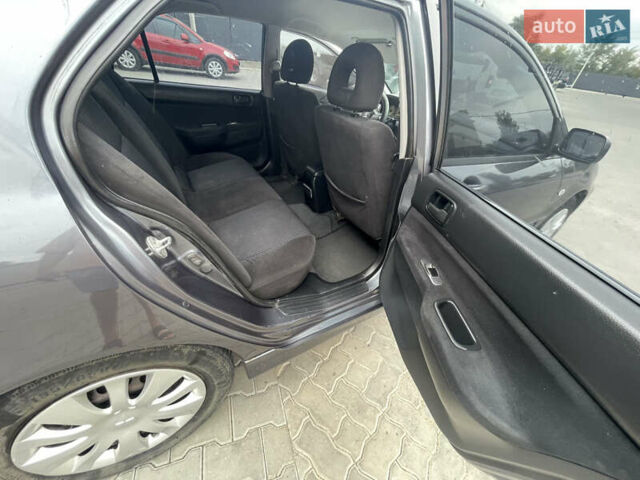 Сірий Міцубісі Lancer, об'ємом двигуна 1.58 л та пробігом 162 тис. км за 4650 $, фото 10 на Automoto.ua