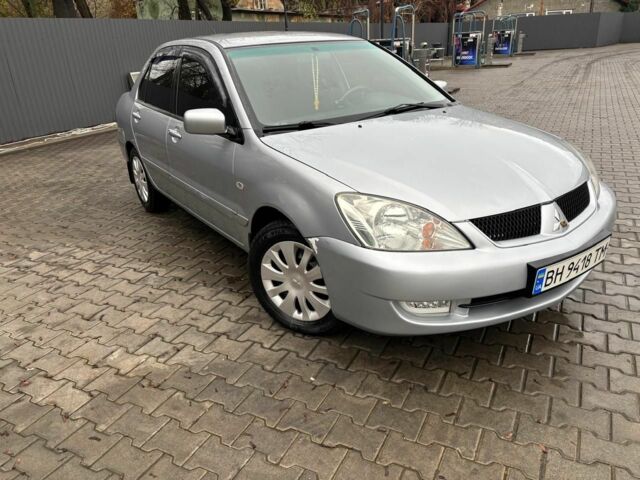 Серый Мицубиси Лансер, объемом двигателя 1.6 л и пробегом 260 тыс. км за 4999 $, фото 2 на Automoto.ua