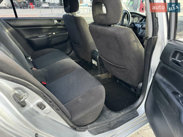 Сірий Міцубісі Lancer, об'ємом двигуна 1.58 л та пробігом 333 тис. км за 2999 $, фото 15 на Automoto.ua