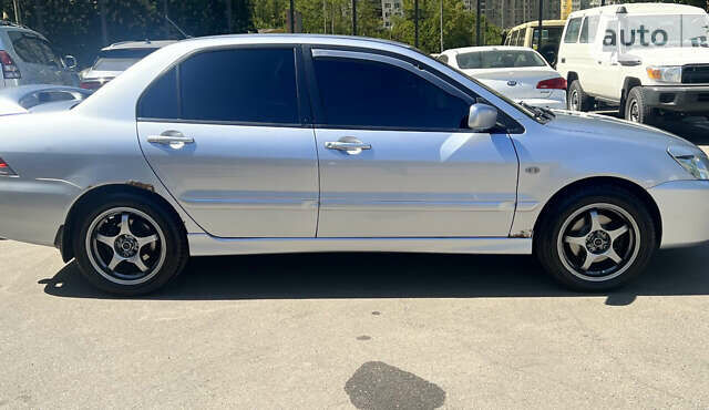 Сірий Міцубісі Lancer, об'ємом двигуна 1.58 л та пробігом 190 тис. км за 4900 $, фото 4 на Automoto.ua