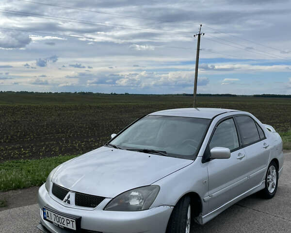 Сірий Міцубісі Lancer, об'ємом двигуна 2 л та пробігом 319 тис. км за 4199 $, фото 2 на Automoto.ua