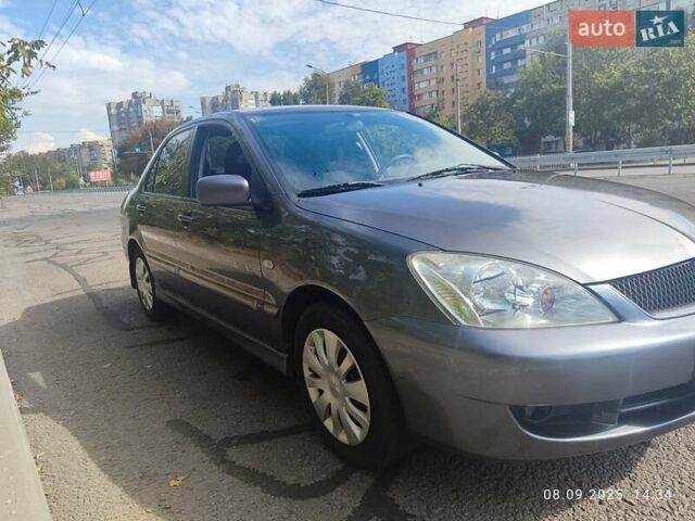Сірий Міцубісі Lancer, об'ємом двигуна 1.6 л та пробігом 242 тис. км за 4900 $, фото 4 на Automoto.ua