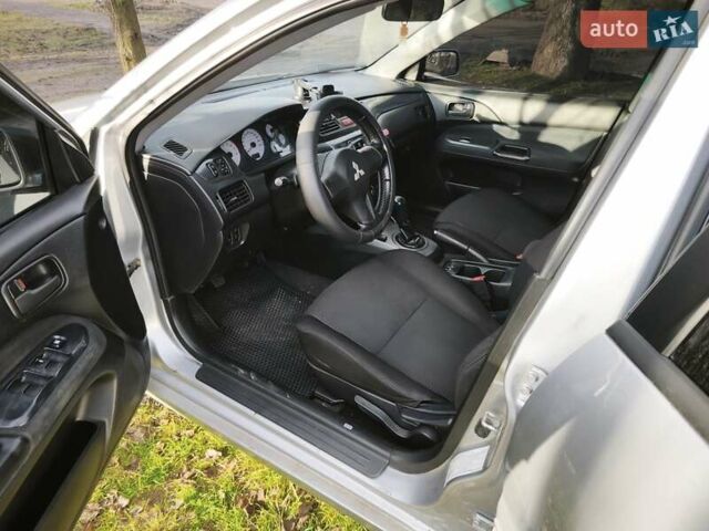 Серый Мицубиси Лансер, объемом двигателя 1.6 л и пробегом 234 тыс. км за 4300 $, фото 2 на Automoto.ua