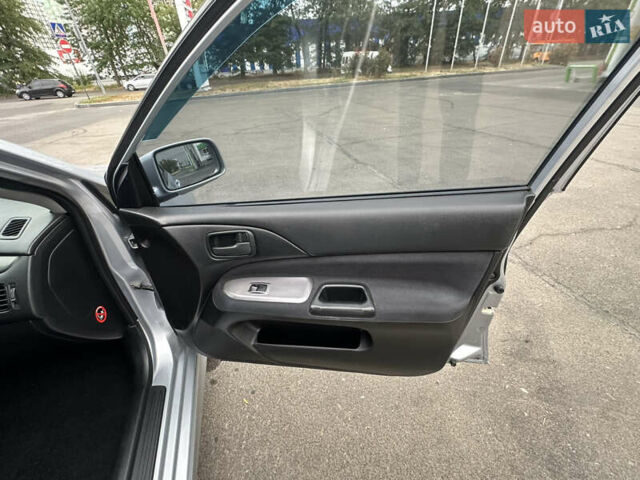 Серый Мицубиси Лансер, объемом двигателя 1.58 л и пробегом 183 тыс. км за 4800 $, фото 26 на Automoto.ua