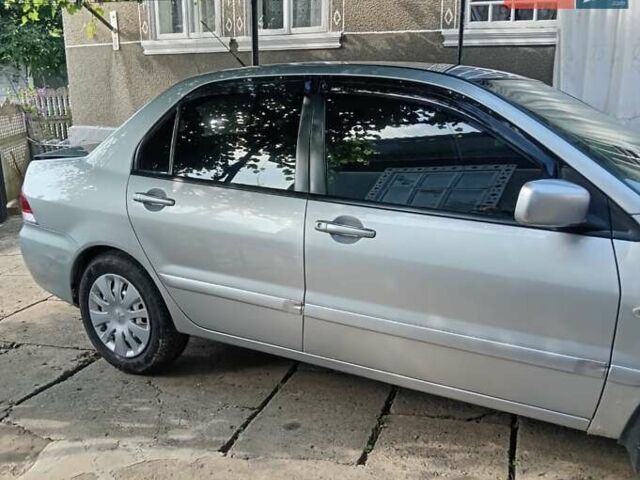 Серый Мицубиси Лансер, объемом двигателя 1.6 л и пробегом 188 тыс. км за 4450 $, фото 1 на Automoto.ua