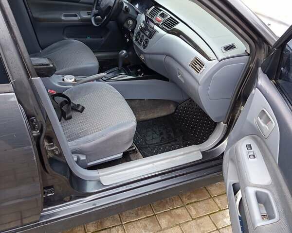 Сірий Міцубісі Lancer, об'ємом двигуна 2 л та пробігом 212 тис. км за 3333 $, фото 7 на Automoto.ua