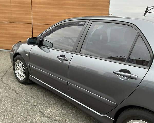 Сірий Міцубісі Lancer, об'ємом двигуна 1.6 л та пробігом 260 тис. км за 4998 $, фото 20 на Automoto.ua