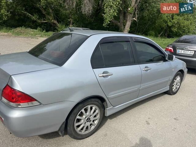 Сірий Міцубісі Lancer, об'ємом двигуна 1.58 л та пробігом 197 тис. км за 3450 $, фото 5 на Automoto.ua