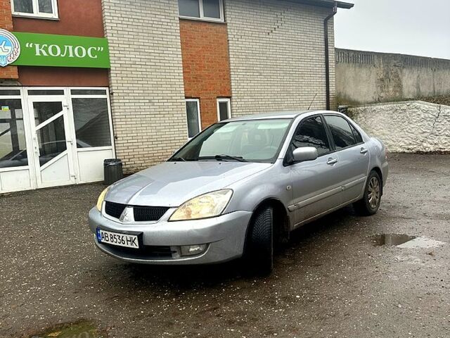 Серый Мицубиси Лансер, объемом двигателя 1.6 л и пробегом 123 тыс. км за 4000 $, фото 1 на Automoto.ua