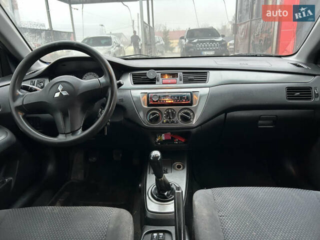 Сірий Міцубісі Lancer, об'ємом двигуна 1.6 л та пробігом 223 тис. км за 3900 $, фото 9 на Automoto.ua