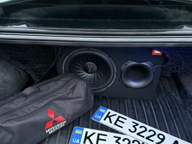 Серый Мицубиси Лансер, объемом двигателя 2 л и пробегом 256 тыс. км за 7000 $, фото 4 на Automoto.ua