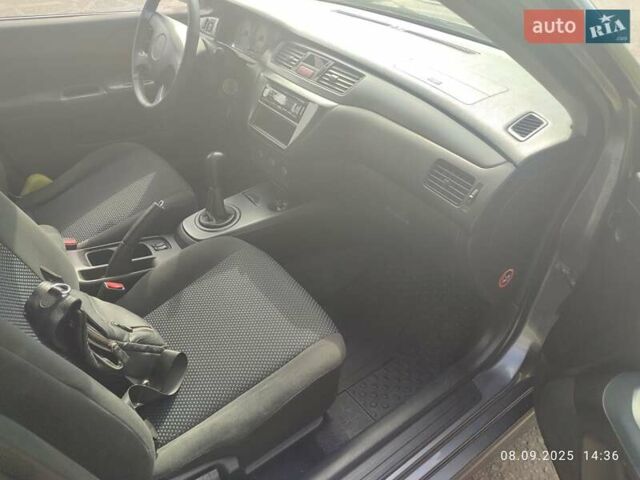 Сірий Міцубісі Lancer, об'ємом двигуна 1.6 л та пробігом 242 тис. км за 4900 $, фото 22 на Automoto.ua