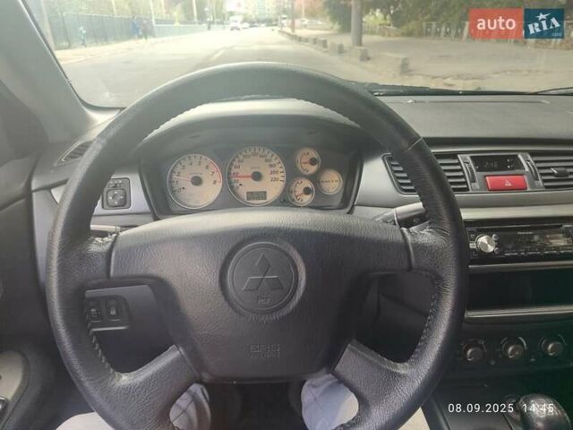 Сірий Міцубісі Lancer, об'ємом двигуна 1.6 л та пробігом 242 тис. км за 4900 $, фото 34 на Automoto.ua