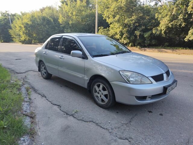 Сірий Міцубісі Lancer, об'ємом двигуна 1.6 л та пробігом 320 тис. км за 4299 $, фото 1 на Automoto.ua